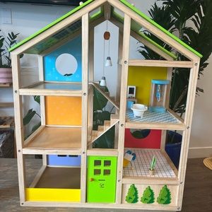 Hape three story wooden dollhouse with some accessories